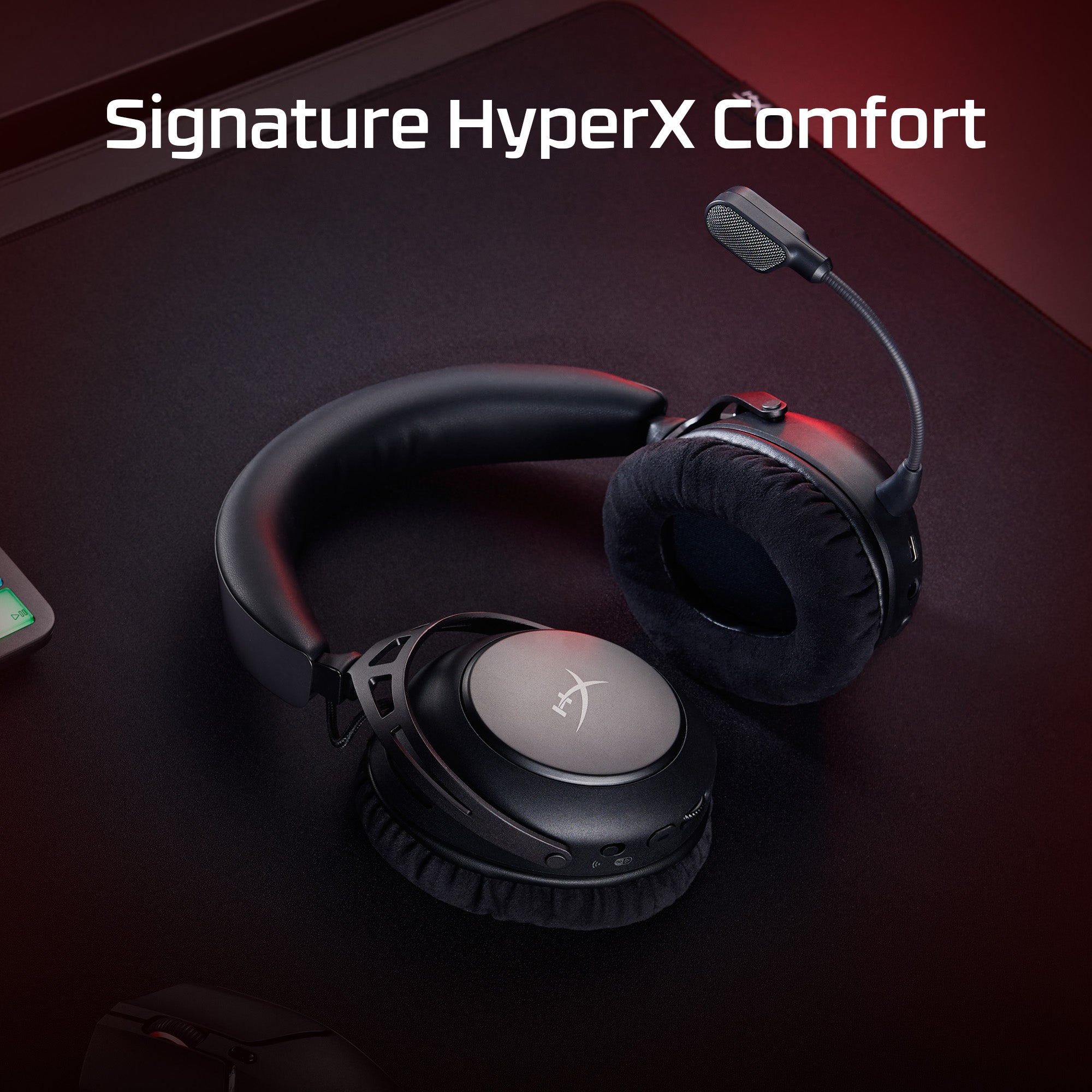 Black HyperX gaming headset on a dark surface with 'Signature HyperX Comfort' text.