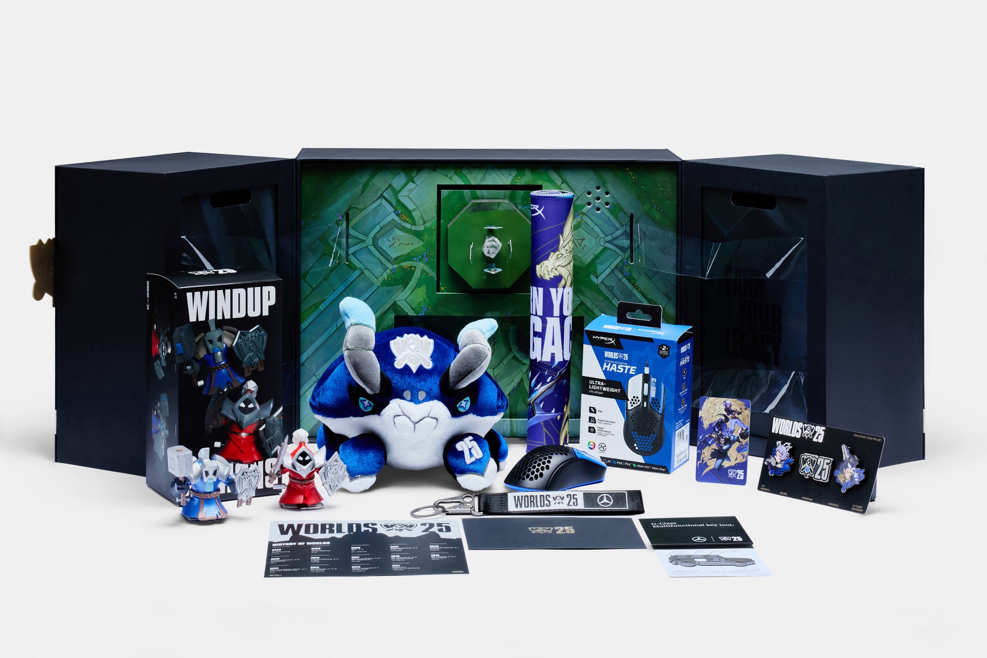 Collection of Worlds Unlocked 2025 collectible figurines and packaging on a white background