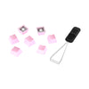 scattered view of HyperX rubber keycaps in pink with keycap removal tool