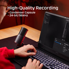 Person using a laptop with a microphone, highlighting high-quality recording features.
